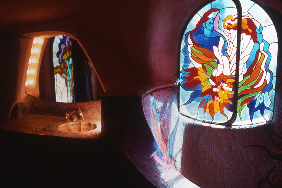 Bathroom with stained glass and mosaic tile.