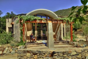 Elfin Forest Interpretive Center. Exterior with planters, carved columns, mosaic, and outdoor patio. Photo by Natalie Hein. sustainable architecture-organic architecture-natural building-icf-hubbell and hubbell-san diego,california