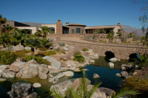 Strawbale home with water feature and desert plantings. Photo: Juergen Zierler.
