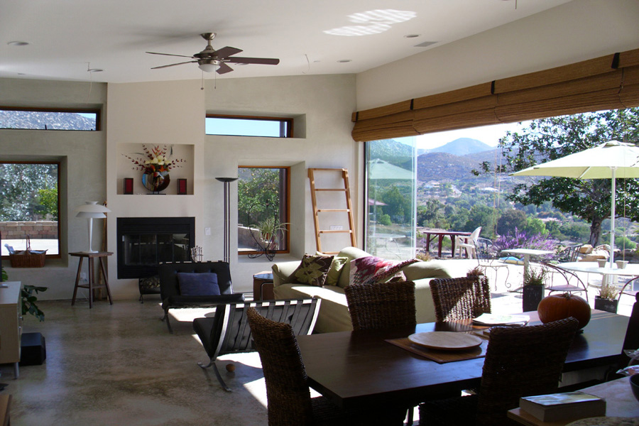 The living room opens out to the patio and mountains. Photo by Alex Miller.