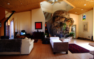 Living room with boulder and cool tower. Photo by Ryan Pennell.